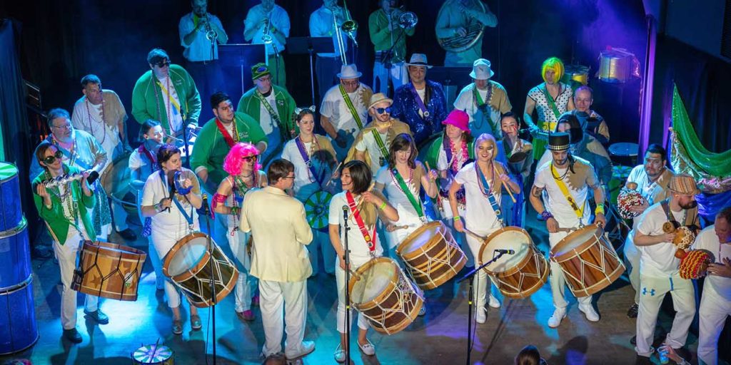 Group of drummers performing Brazilian percussion on stage